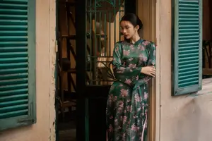 Elegant Asian Beauty: Serene Woman in Modernized Traditional Dress with Vintage Floral Vase-7