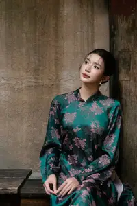 Elegant Asian Beauty: Serene Woman in Modernized Traditional Dress with Vintage Floral Vase-14