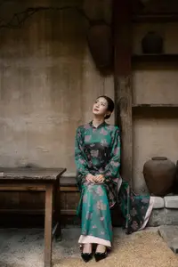 Elegant Asian Beauty: Serene Woman in Modernized Traditional Dress with Vintage Floral Vase-5