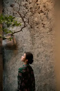 Elegant Asian Beauty: Serene Woman in Modernized Traditional Dress with Vintage Floral Vase-13