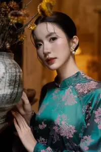 Elegant Asian Beauty: Serene Woman in Modernized Traditional Dress with Vintage Floral Vase-15