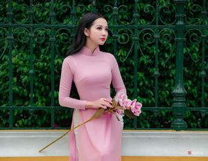 Graceful Vietnamese Woman in Pink Ao Dai: A Stunning Portrayal of Traditional Asian Beauty 1000019457-14