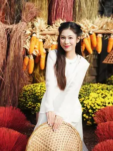 Pure Elegance of White Ao Dai in Traditional Vietnamese Setting-8