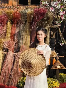 Pure Elegance of White Ao Dai in Traditional Vietnamese Setting-12