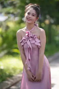 Gentle Charm: A Girl in an Elegant Pink Dress Amidst Nature's Embrace-7