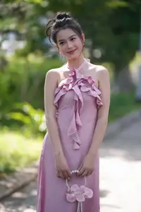 Gentle Charm: A Girl in an Elegant Pink Dress Amidst Nature's Embrace-0