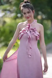Gentle Charm: A Girl in an Elegant Pink Dress Amidst Nature's Embrace-8
