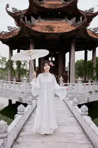 Elegant White Ao Dai with Pink Lotus Flower Embracing Cultural Heritage-9