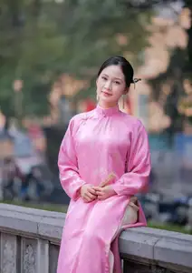 Discover the Graceful Beauty of a Vietnamese Girl in Traditional Pink Ao Dai 1000028168-1