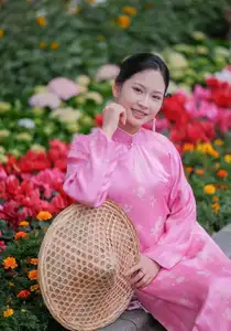 Discover the Graceful Beauty of a Vietnamese Girl in Traditional Pink Ao Dai 1000028168-6