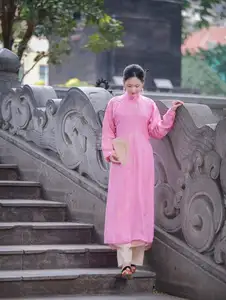 Discover the Graceful Beauty of a Vietnamese Girl in Traditional Pink Ao Dai 1000028168-7