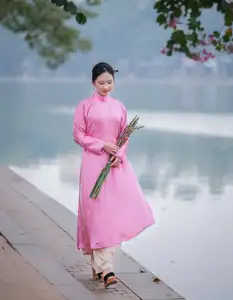 Discover the Graceful Beauty of a Vietnamese Girl in Traditional Pink Ao Dai 1000028168-5