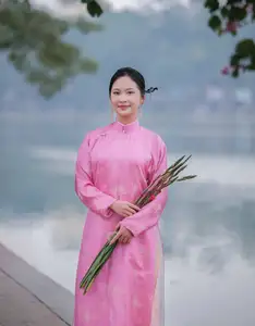 Discover the Graceful Beauty of a Vietnamese Girl in Traditional Pink Ao Dai 1000028168-4