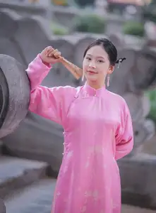 Discover the Graceful Beauty of a Vietnamese Girl in Traditional Pink Ao Dai 1000028168-3