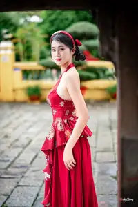 Elegant Asian Beauty in Red Dress Shines Gracefully Amidst a Traditional Garden 1000024509-2
