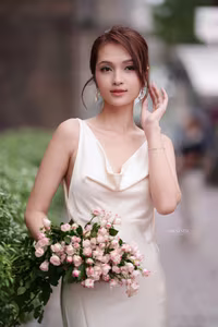 VGU No.11: Elegant Charm: A Woman's Grace in White Gown and Delicate Rose Bouquet-0