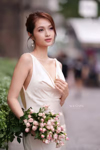 VGU No.11: Elegant Charm: A Woman's Grace in White Gown and Delicate Rose Bouquet-1