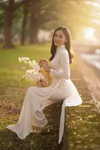 Serene Vietnamese Beauty in White Ao Dai Bathed in Golden Sunset Light-0