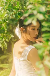 Dreamy Reflection: Girl in white dress finds gentle elegance in a garden mirror.-1