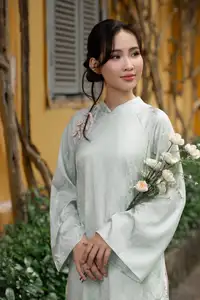 Graceful Vietnamese Woman in Light Green Ao Dai Amidst Tranquil Garden-10