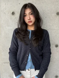 Timeless elegance of classic black bob hair amidst the lush green forest-4