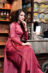 Discover Vietnamese Ao Dai Beauty: Elegant, Graceful Girl in a Cafe Setting-10