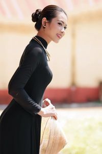 Graceful Vietnamese Woman in Elegant Black Ao Dai-7