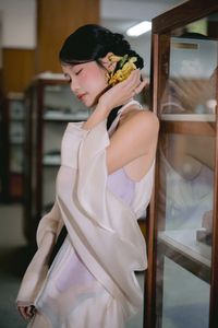 Captivating Asian Beauty: Elegant Young Woman with Braided Hair and Dreamy Gaze - 1000019730-5