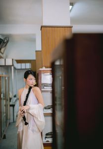 Captivating Asian Beauty: Elegant Young Woman with Braided Hair and Dreamy Gaze - 1000019730-0