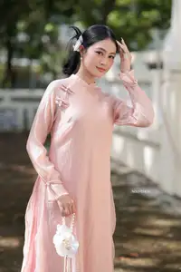 Timeless Beauty: Elegant Vietnamese Girl in Graceful Pink Ao Dai 1000024694-2