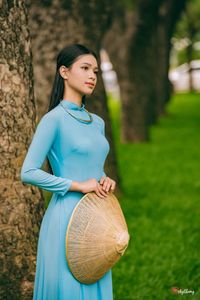 Graceful Vietnamese Woman in Blue Ao Dai Elegant Traditional Beauty-0