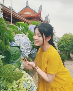 Serene Moments with Hydrangeas: A Young Woman's Nature Portrait-0