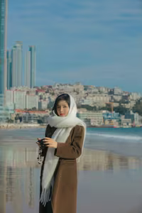VGU No.81: Elegant Woman on a Winter Beach: A Pensive Moment of Style and Serenity.-0