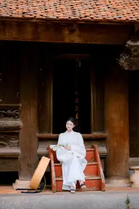 Pure Beauty: Girl in White with Orchids - Grace and Serenity of East Asian Charm-6