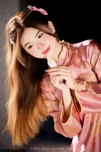 Captivating Serenity: Vietnamese Girl in Pink Ao Dai with Lotus Flowers1730591-34