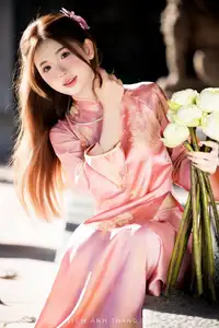 Captivating Serenity: Vietnamese Girl in Pink Ao Dai with Lotus Flowers1730591-28