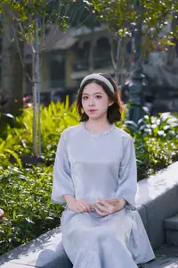 Serene Beauty: Vietnamese Young Woman by the Lake in Traditional Attire-6