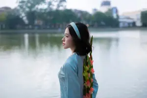 Serene Beauty: Vietnamese Young Woman by the Lake in Traditional Attire-3