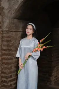 Serene Beauty: Vietnamese Young Woman by the Lake in Traditional Attire-1