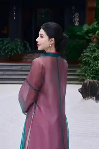 Graceful East Asian Beauty: Traditional Charm in a Lush Green Garden-1