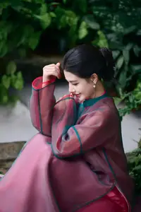 Graceful East Asian Beauty: Traditional Charm in a Lush Green Garden-0