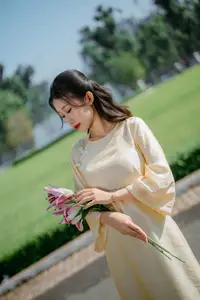 Serene Vietnamese Beauty in Ao Dai with Lilies: A Moment of Grace and Tranquility-2