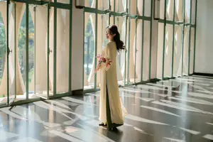 Serene Vietnamese Beauty in Ao Dai with Lilies: A Moment of Grace and Tranquility-10