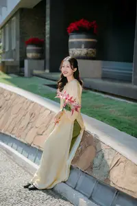Serene Vietnamese Beauty in Ao Dai with Lilies: A Moment of Grace and Tranquility-5