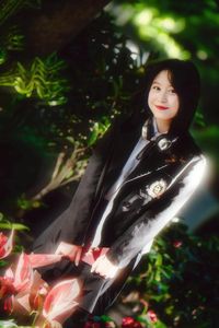 Discover the captivating smile of an Asian girl amidst vibrant nature-4