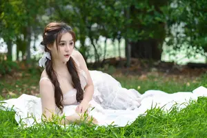 Ethereal Beauty: Young Woman in White Amidst Lush Green Nature-5