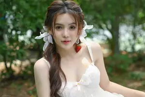Ethereal Beauty: Young Woman in White Amidst Lush Green Nature-3