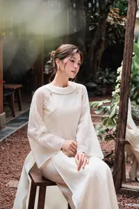 Elegant Vietnamese Muse: Graceful Modern Ao Dai in a Serene Setting-0