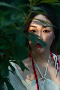 Elegant Woman in White Dress Amidst Lush Green Nature-4