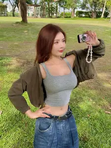 Vibrant Street Style: Young Woman Radiates Energy in Urban Chic Outfit-1